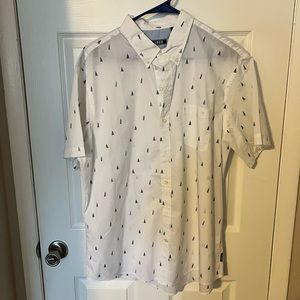IZOD white shirt sleeved button down with light and dark blue ships. XL.